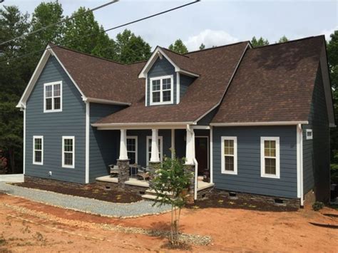 brown metal roof gray house|dark brown roof with trim.